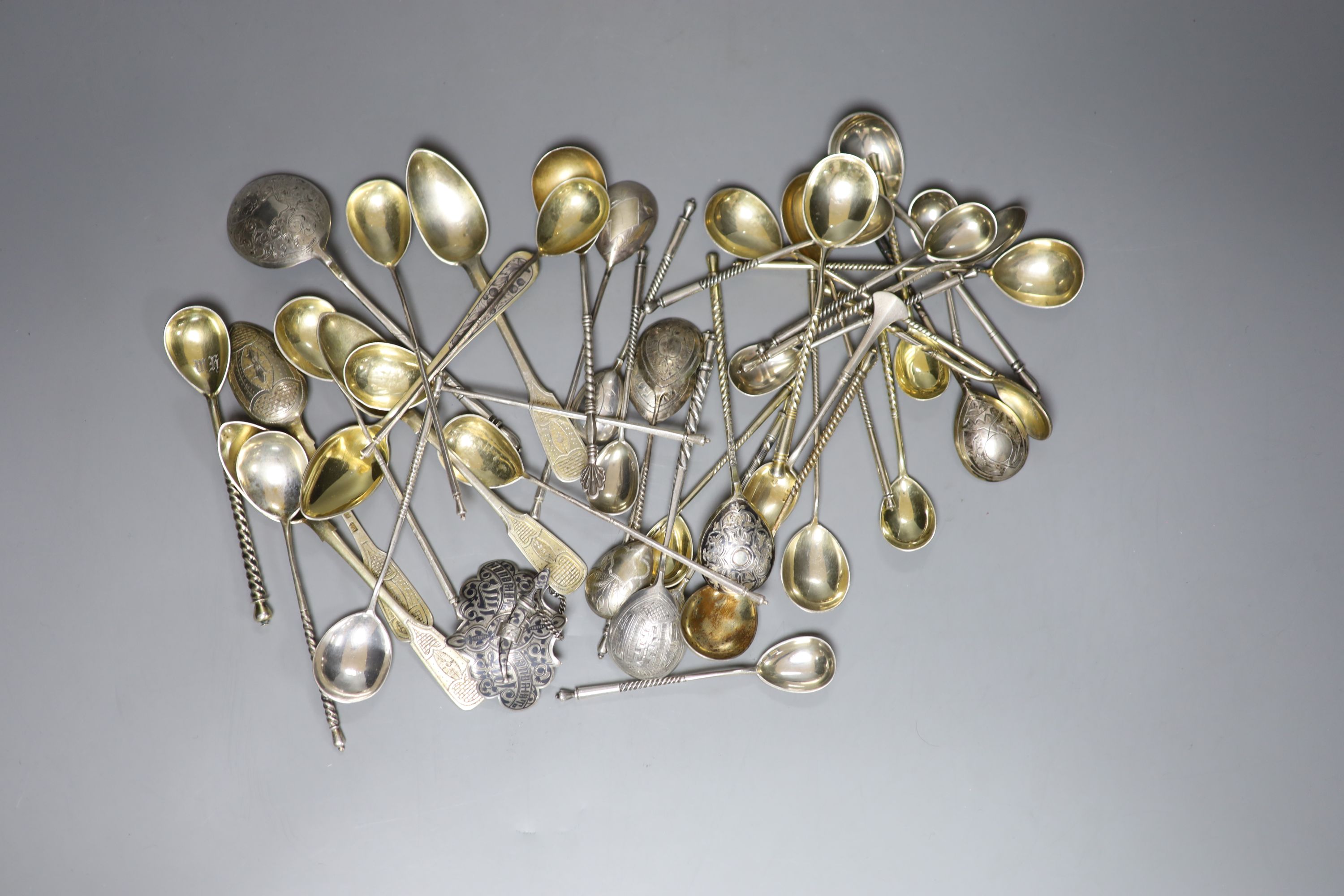 A late 19th century Russian 84 zolotnik and niello belt buckle and a quantity of assorted Russian 84 zolotnik teaspoons etc.